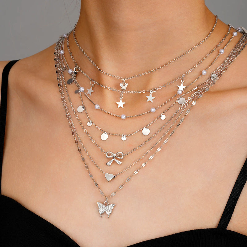 Conjunto de 7 Colares Femininos com Pingentes Estrela, Borboleta e Nó, Estilo Boho Elegante e Versátil