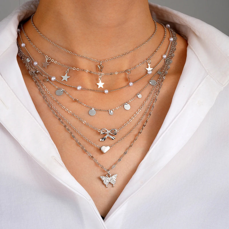 Conjunto de 7 Colares Femininos com Pingentes Estrela, Borboleta e Nó, Estilo Boho Elegante e Versátil