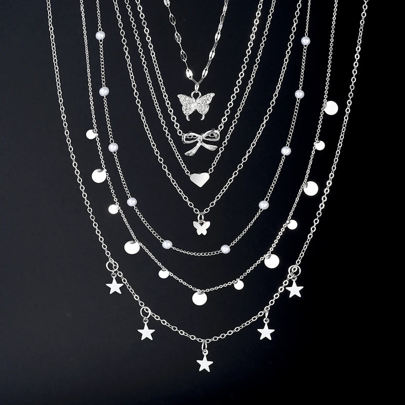 Conjunto de 7 Colares Femininos com Pingentes Estrela, Borboleta e Nó, Estilo Boho Elegante e Versátil