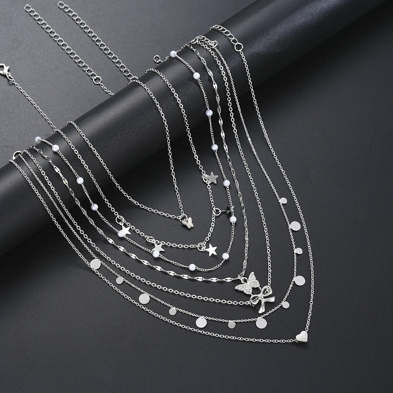 Conjunto de 7 Colares Femininos com Pingentes Estrela, Borboleta e Nó, Estilo Boho Elegante e Versátil